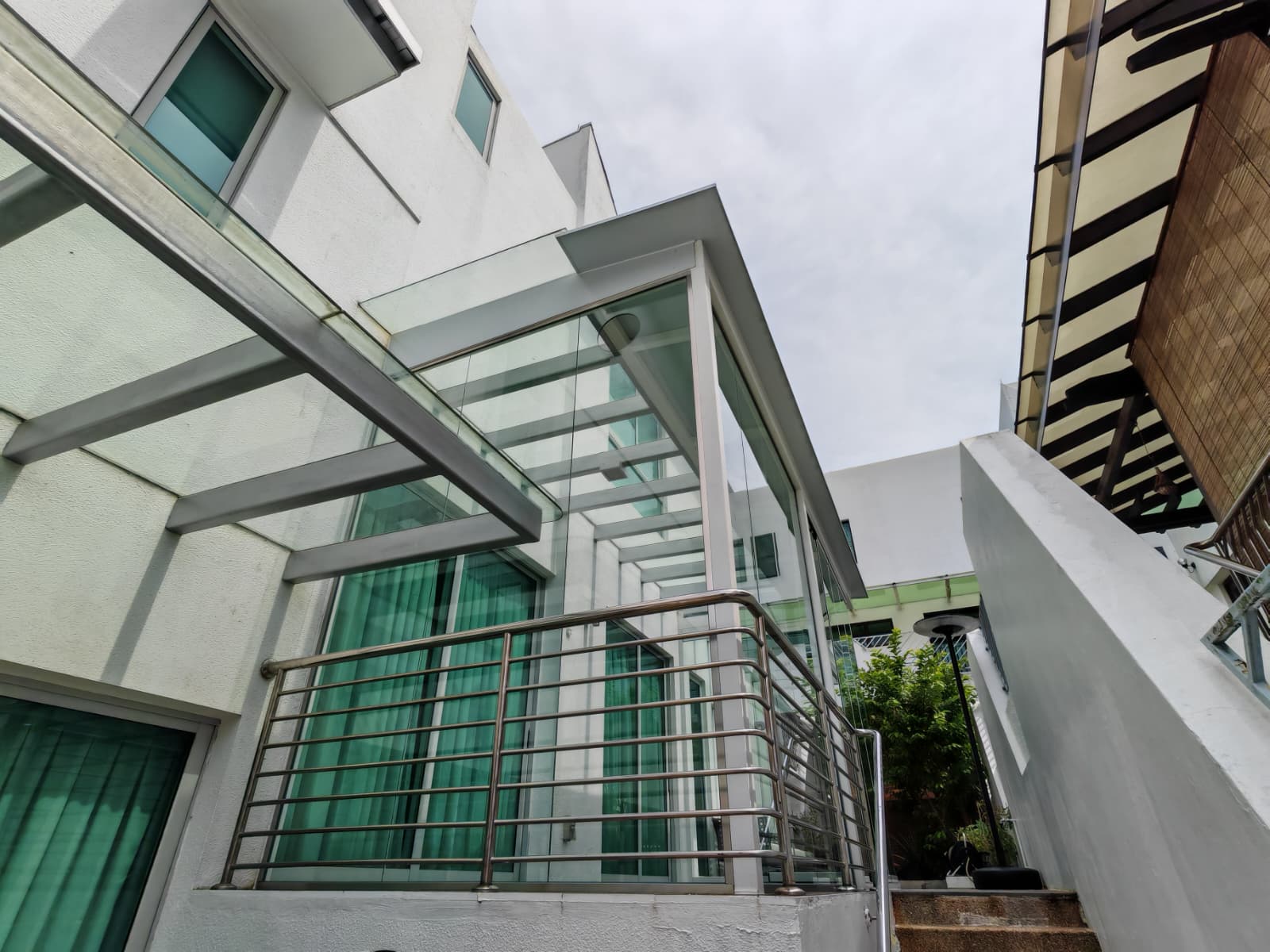 Completed GLASSVIEW Malaysia project showing a clear glass enclosure at a residential property.