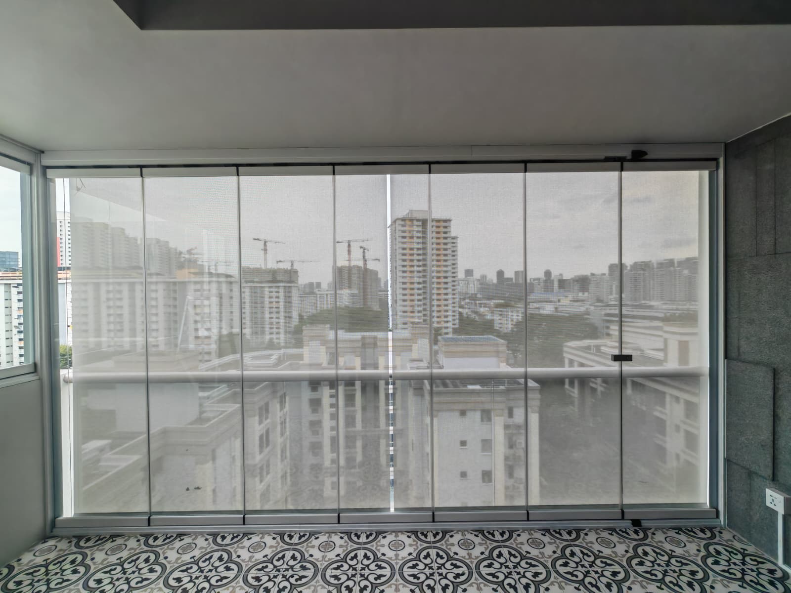 Completed GLASSVIEW Singapore project showing clear glass panels across a residential opening.