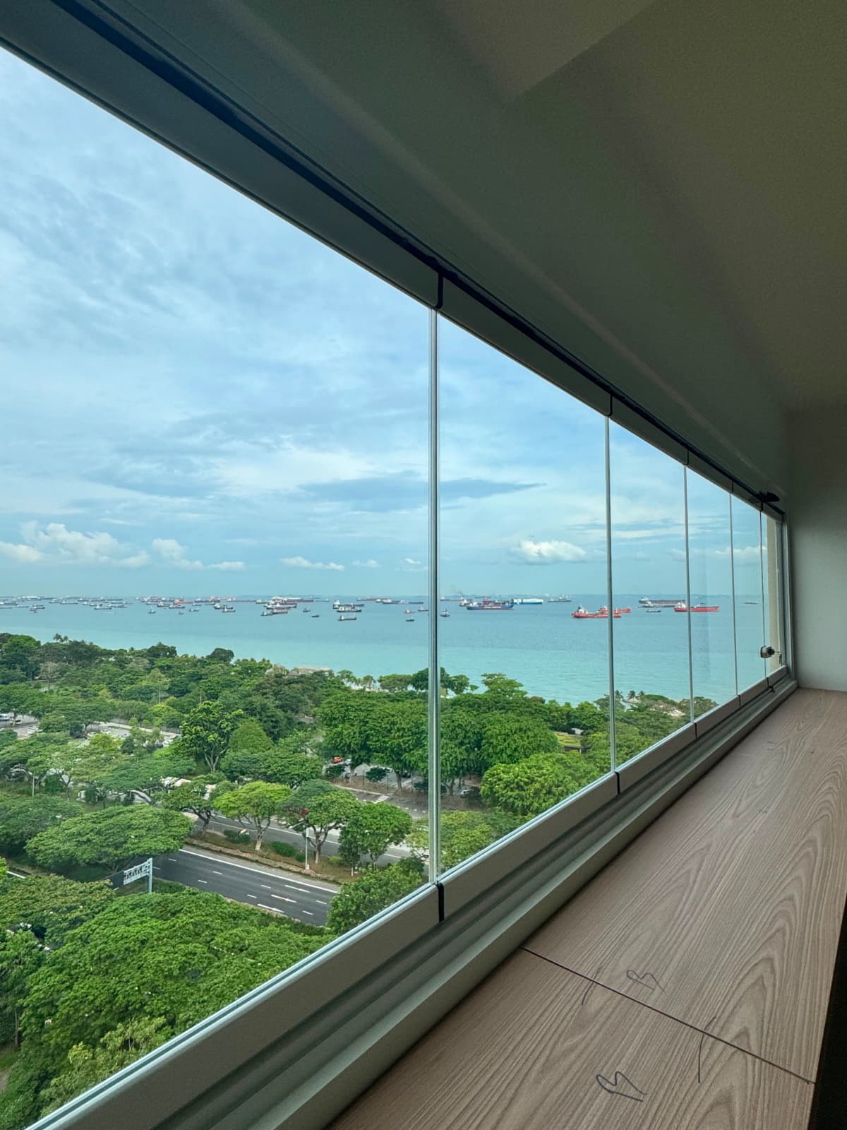 Completed GLASSVIEW Singapore project showing clear glass panels along a wide residential opening.