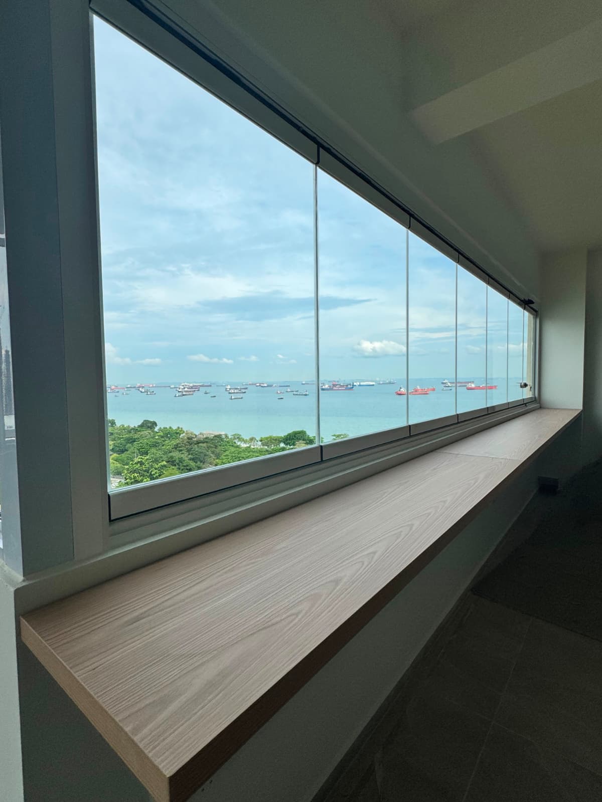 Completed GLASSVIEW Singapore project showing a wide clear glass-panel arrangement at a residential opening.