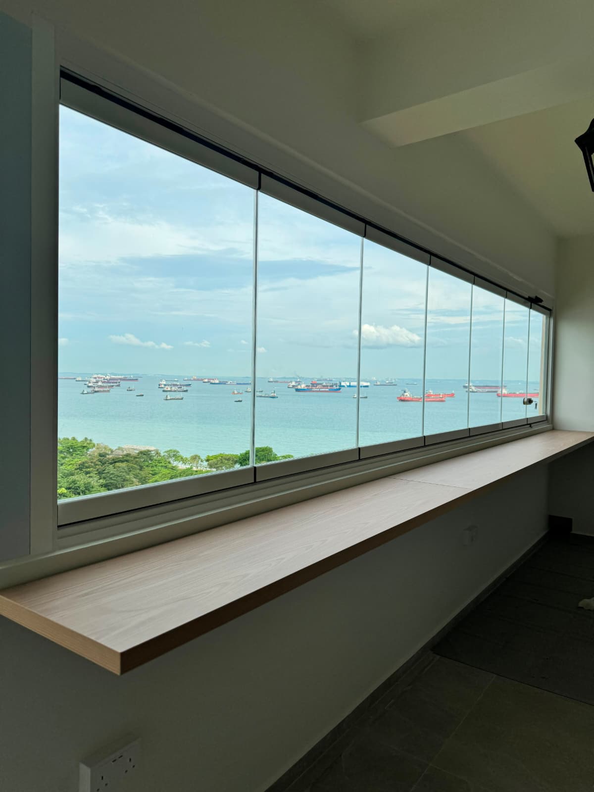 Completed GLASSVIEW Singapore project showing clear glass panels across a residential enclosure.