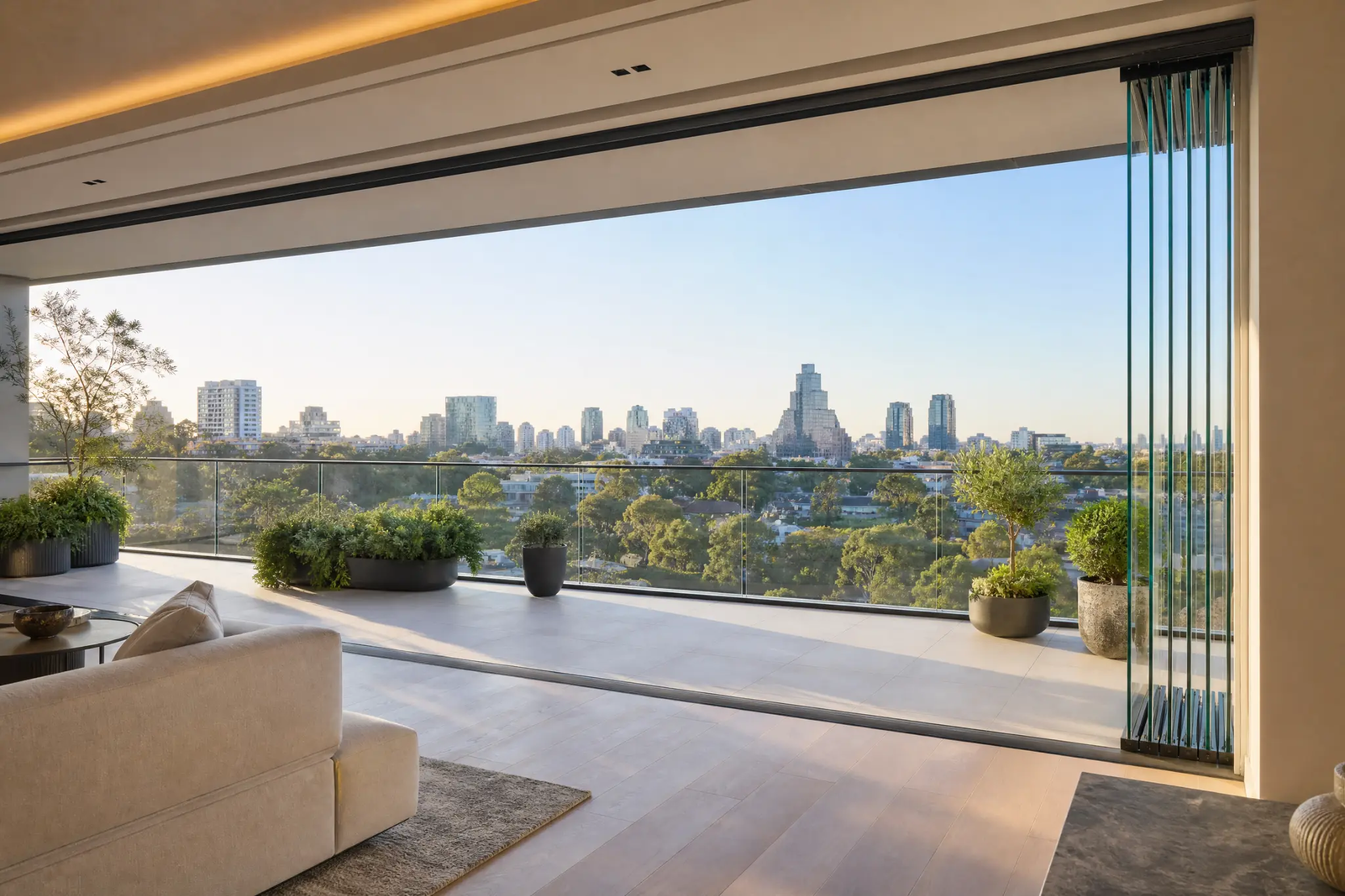 Clear GLASSVIEW Glass System panels opening onto a contemporary balcony